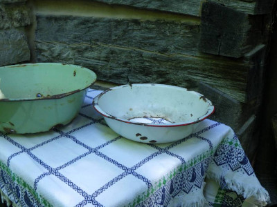 two porcelain bowls on a table with a tablecloth